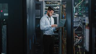 An IT technician who studied through bursary funding. 