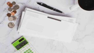 Graduate lays Nsfas loan contract on top of surface
