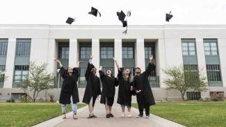 students celebrating their graduation 