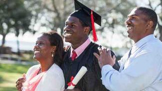 parents with their nsfas-funded child at graduation