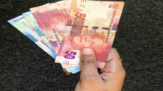 Student holding their Sassa grant money