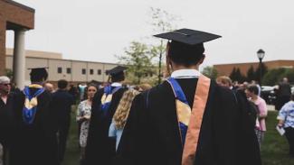Students wearing graduation clothing