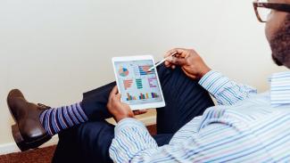 Actuary working on a tablet