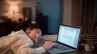 Student writing a scholarship application letter