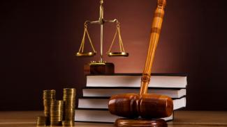Gavel, money, law books and justice scale