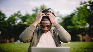 Student frustrated at laptop