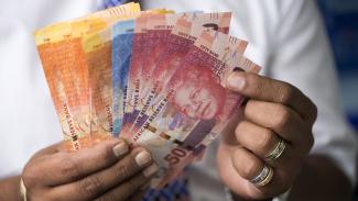Student holding cash